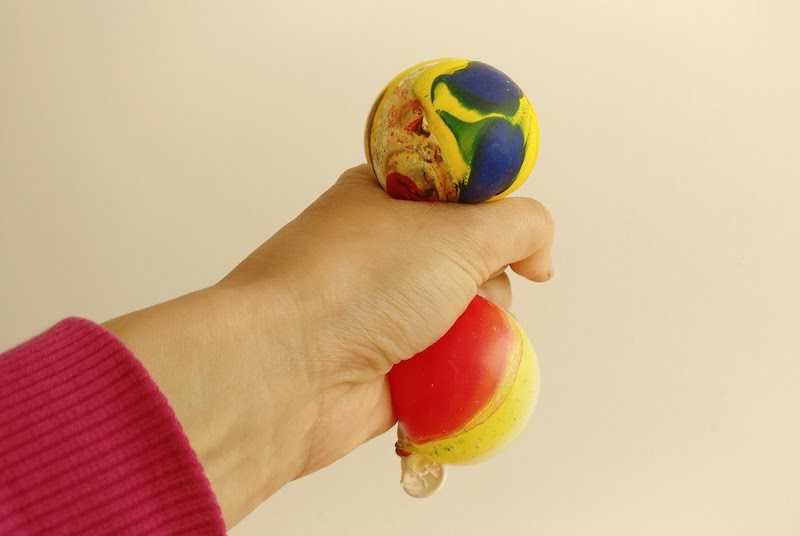 Photo of a hand squeezing a balloon